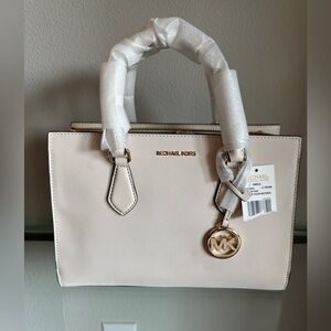 Michael Kors Cream Sheila satchel with crossbody strap.